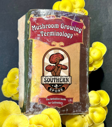 The cover of the "Mushroom Growing Terminology" book from Southern Spore, a definitive guide for cultivators, surrounded by golden oyster mushrooms.